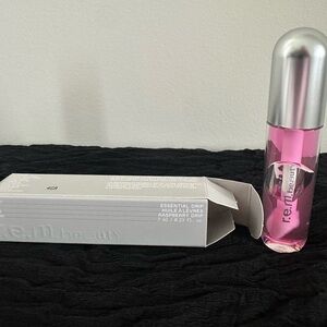 r.e.m. Ariana Grande lip oil - Rasberry Drip